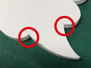 With a conventional machine, cuts made on the back side were visible