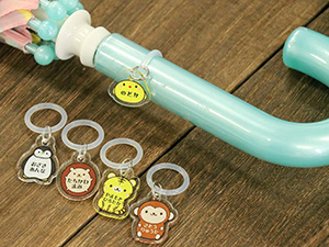 Umbrella markers with the child's name printed.