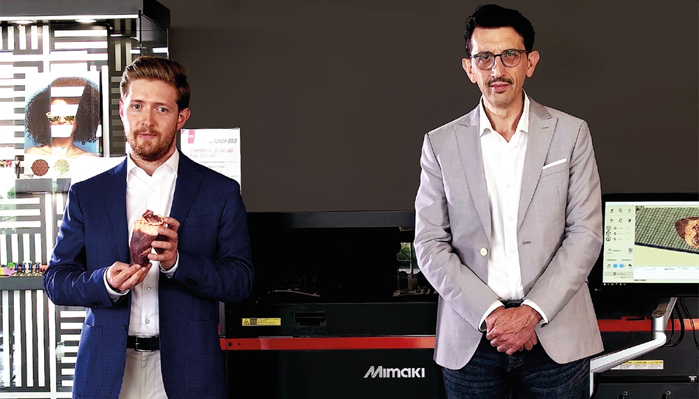 Giacomo Gelati (L) and Professor Fernando Paternostro (R) of the University of Florence presenting their heart model printed on the 3DUJ-553 at Bompan.