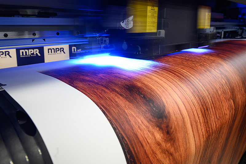 Mimaki's UCJV300 outputting a sheet for a photo background sheet