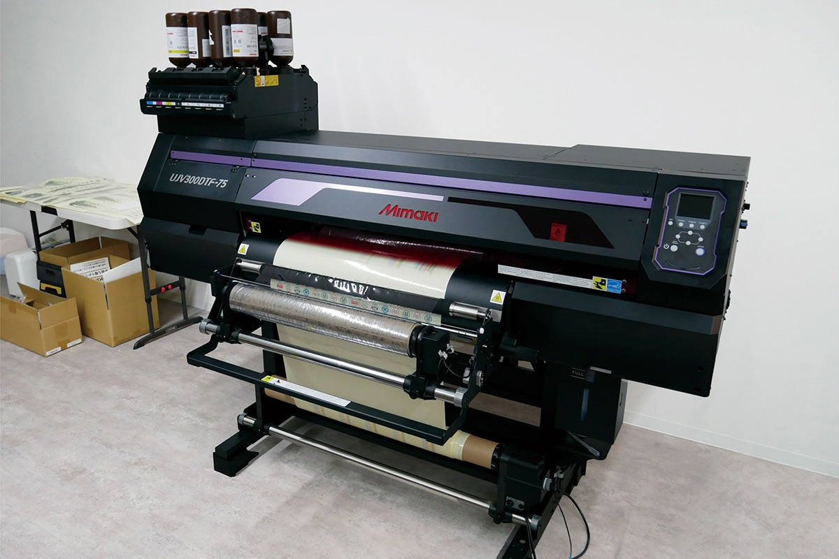 The UJV300DTF-75 UV-DTF printer installed at f.delight’s Machida facility in Tokyo in October 2025